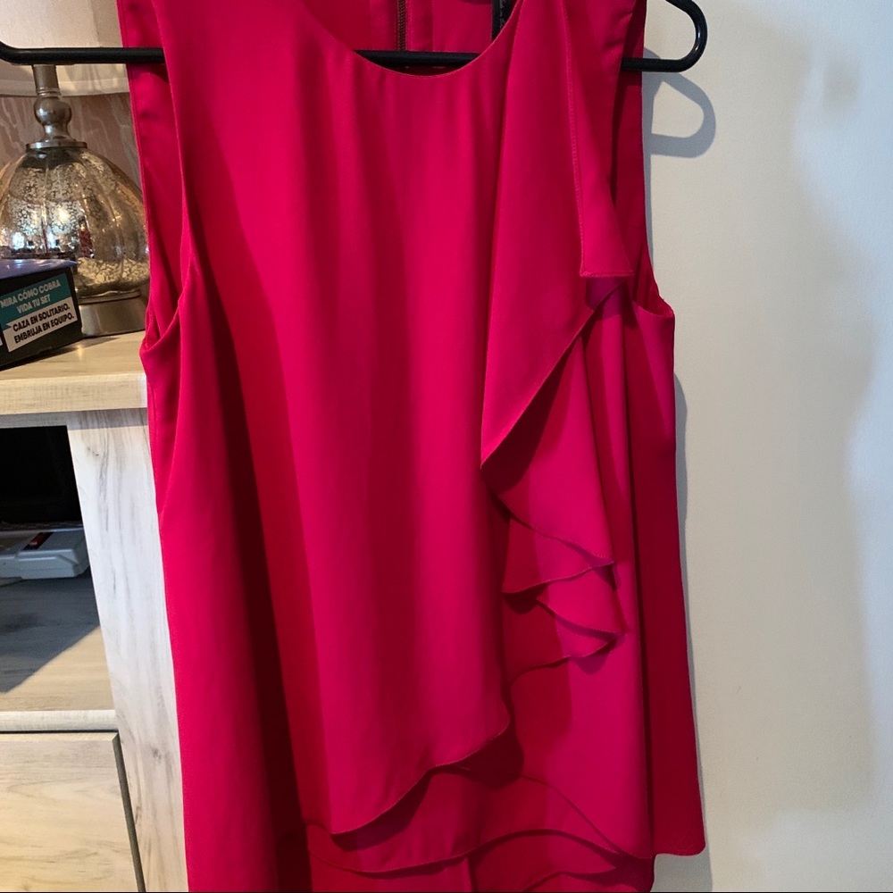 A silk pink sleeveless top with ruffle